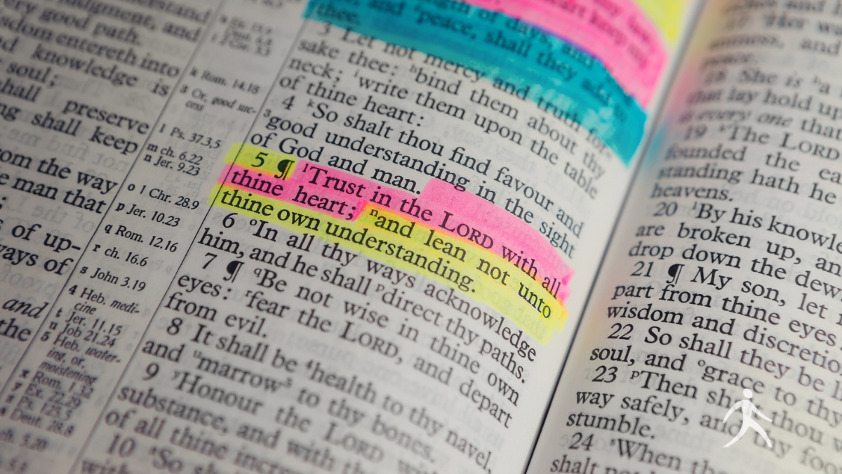 A person highlighting comforting Bible verses