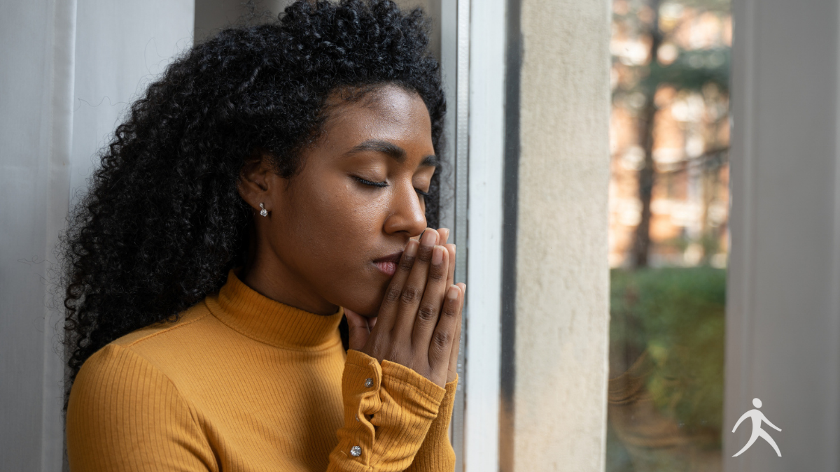 A man praying by an open window, inspired by Daniel
