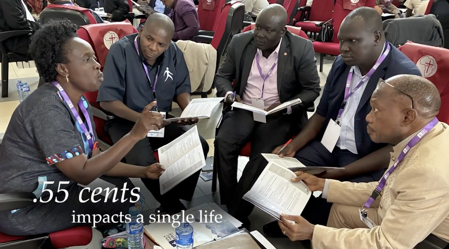 Church leaders in West Africa holding Walk Thru the Bible study guides