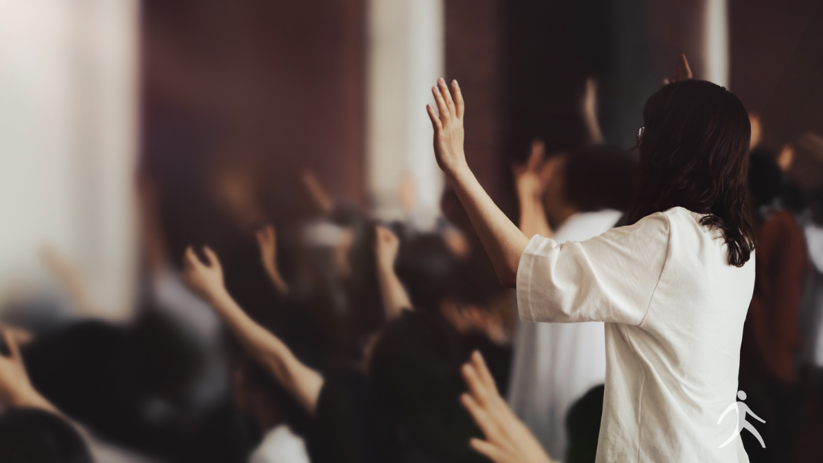 Silhouettes of people singing with hands raised, representing Paul and Silas
